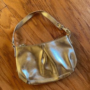 Victoria’s Secret gold purse